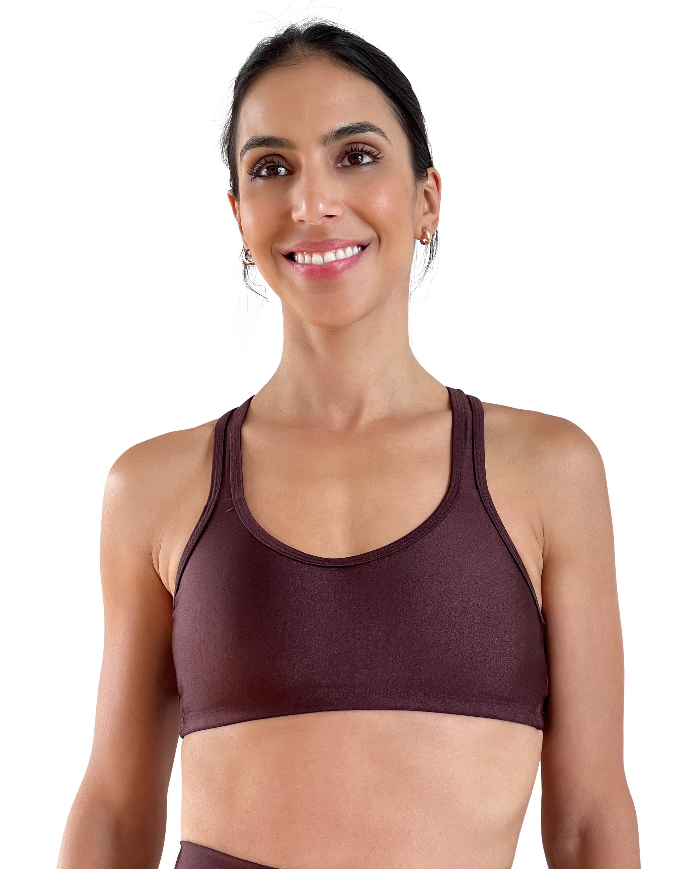 Women's brown racerback sports bra with shiny performance fabric, medium support, and comfortable fit for gym workouts, Pilates, yoga and everyday wear.