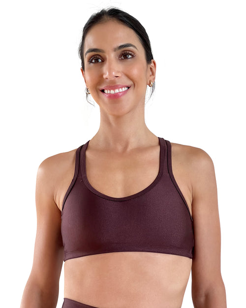 Women's brown racerback sports bra with shiny performance fabric, medium support, and comfortable fit for gym workouts, Pilates, yoga and everyday wear.