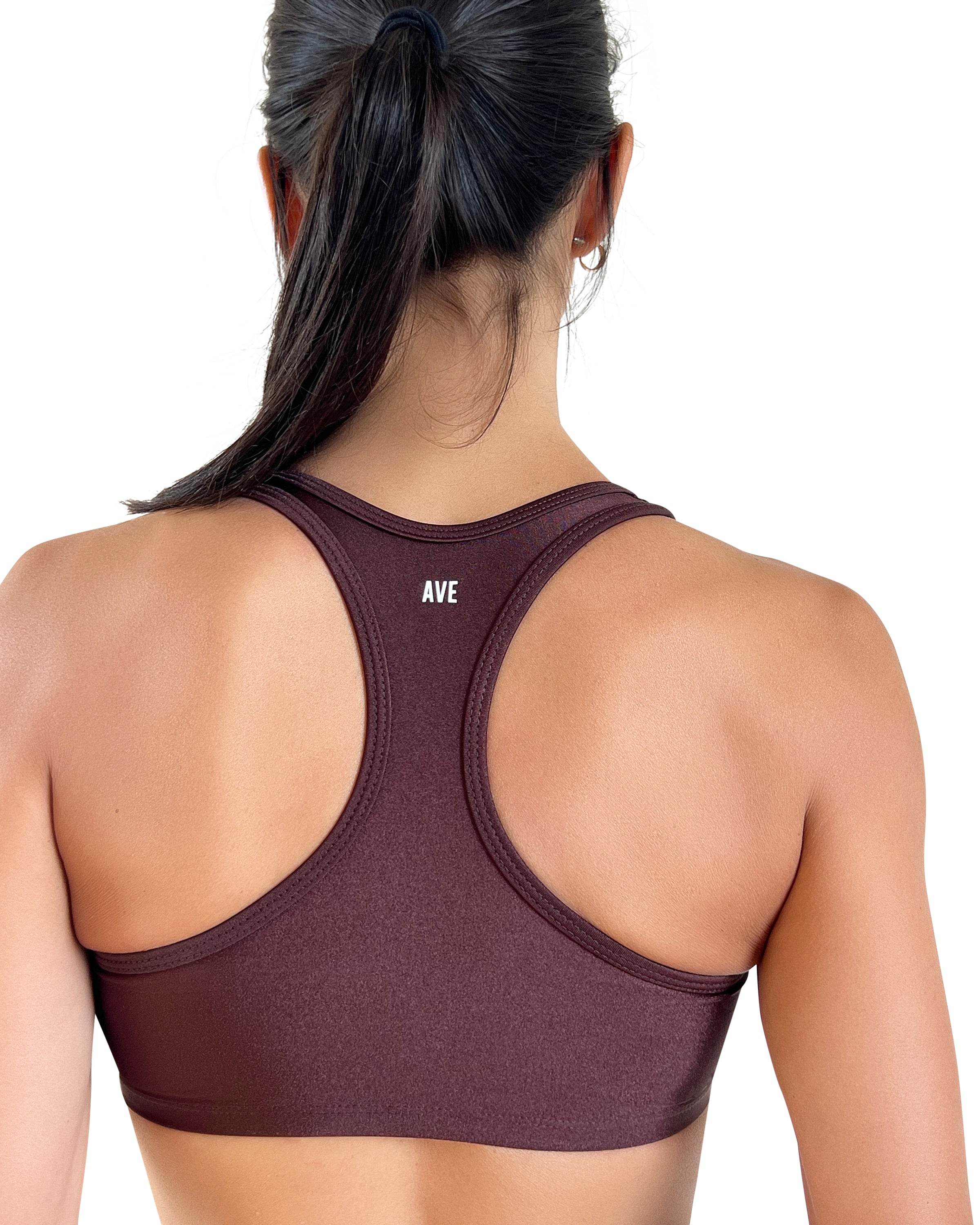 Women's brown racerback sports bra with with AVE branding and shiny performance fabric, medium support, and comfortable fit for gym workouts, Pilates, yoga and everyday wear.