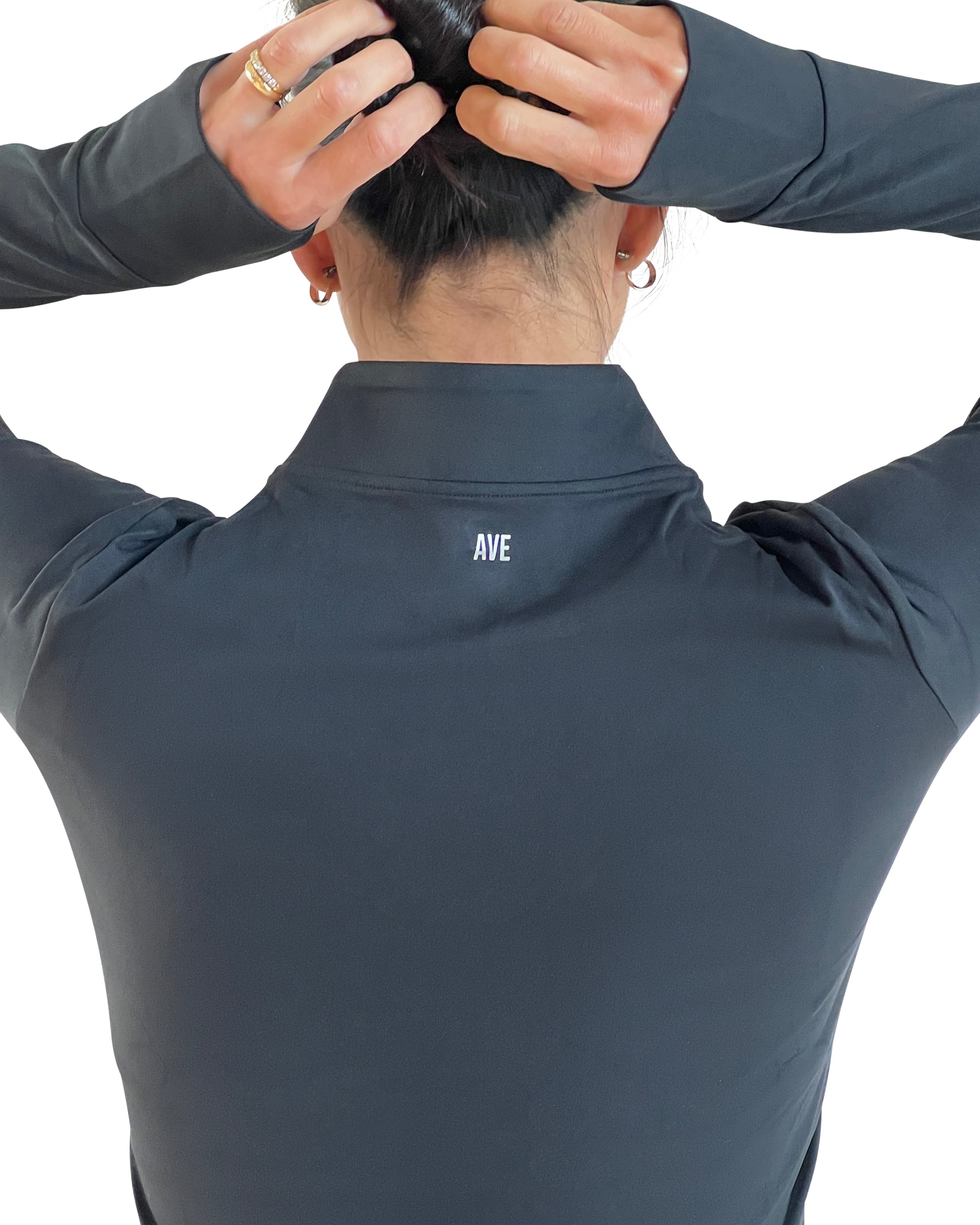 Women's black full-zip activewear jacket with thumbholes, four-way stretch fabric, and a flattering fitted silhouette for training, running, travel, and everyday wear.