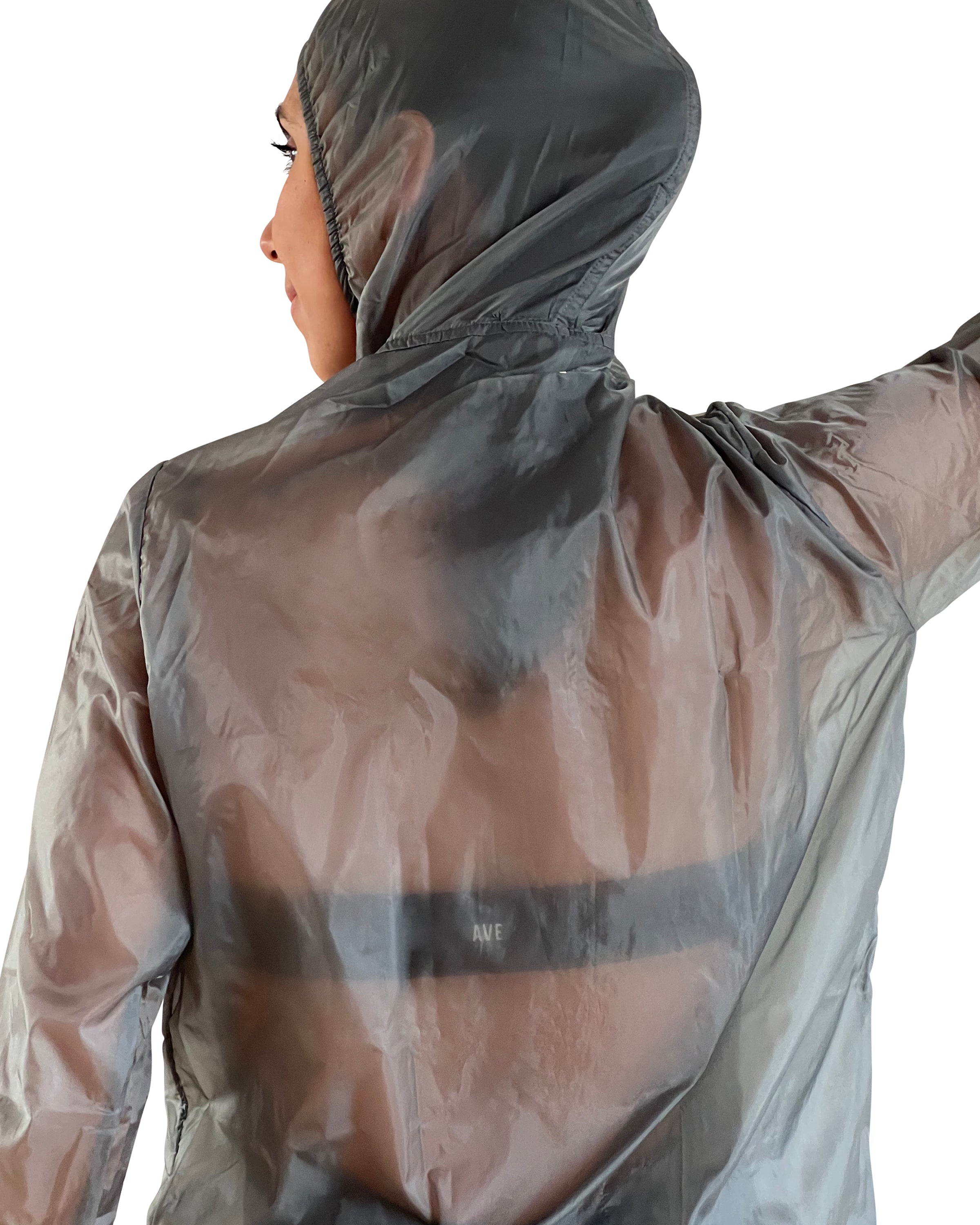 Women's grey lightweight windbreaker jacket with hood, breathable performance fabric, and packable design for travel, walking, and outdoor workouts.