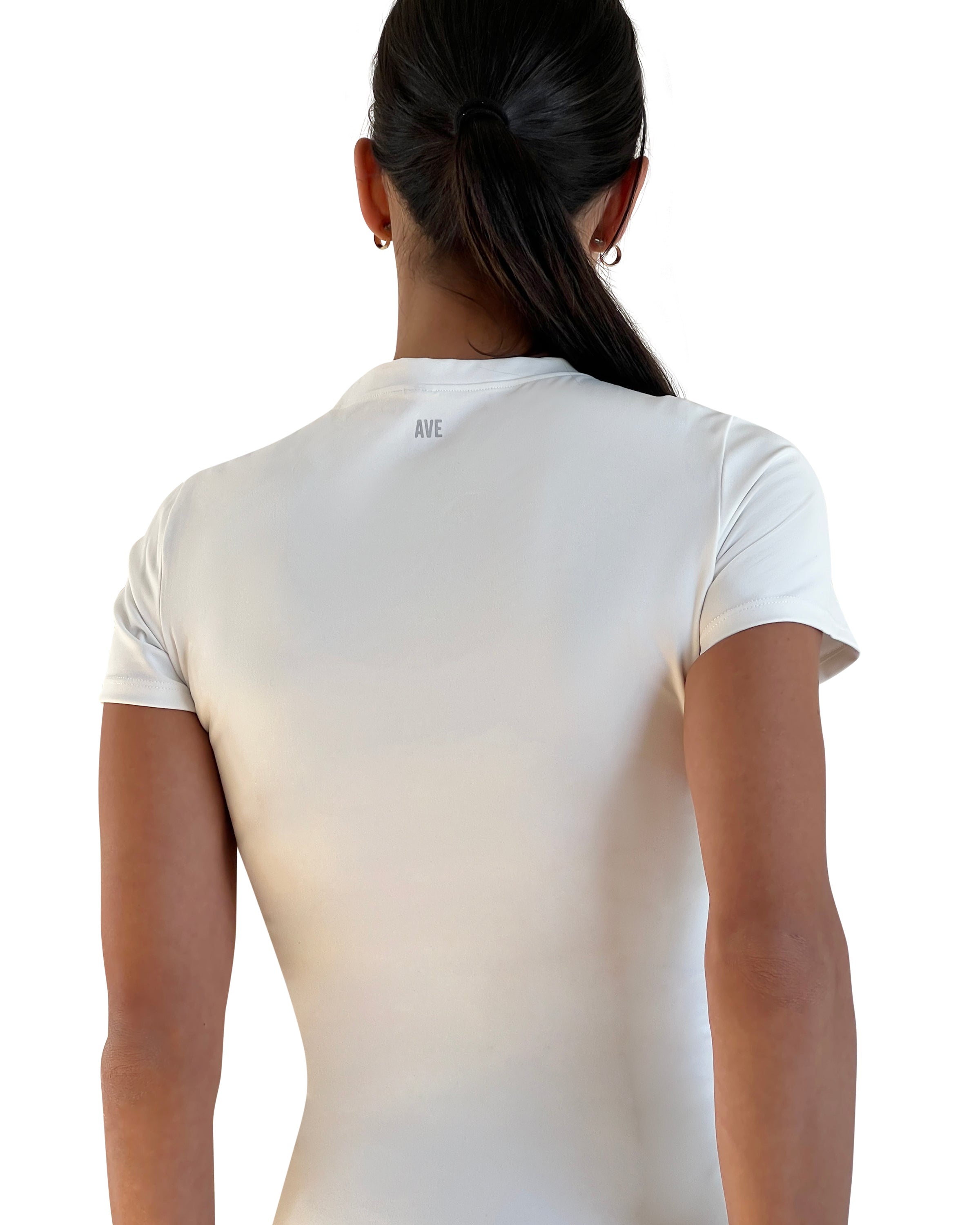 Woman wearing a white t-shirt and navy leggings on a white background for everyday wear.